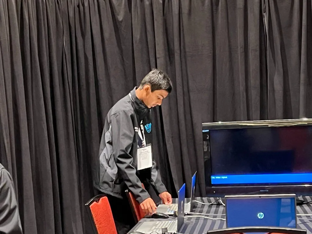 Aditya at a laptop during the CyberPatriot National Finals live round